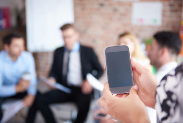 Smartphone and people in the background