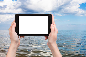 tourist photographs of Azov Sea on tablet pc