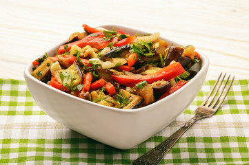 Appetizer - salad with grilled egplants, paprika and garlic.