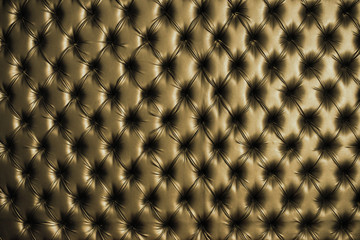 Abstract background texture of an old natural luxury, modern style leather with rhombs. Classic golden grungy skin of retro wall, door, sofa or studio interior.