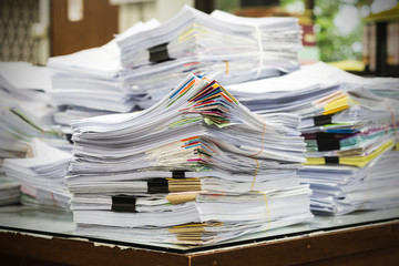 Pile of receipts on the desk - obrazy, fototapety, plakaty