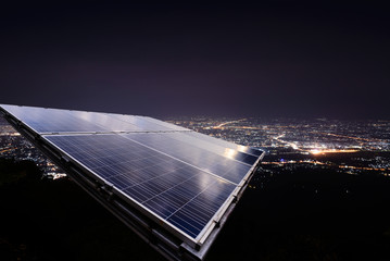 Solar panel with city night light.