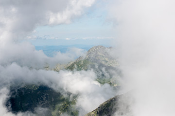rocky mountain landscape covered with clouds