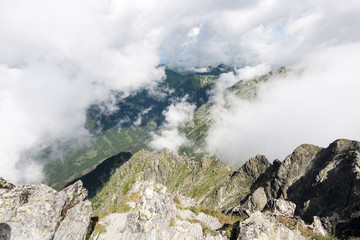 rocky mountain landscape covered with clouds