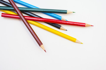 colored pencils on white background