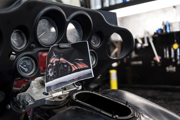 Motorbike dashboard with photo of futuristic bike