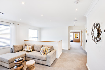 Modern living area with a hallway and white walls