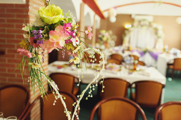 Lovely decorations with flowers in the wedding restaurant
