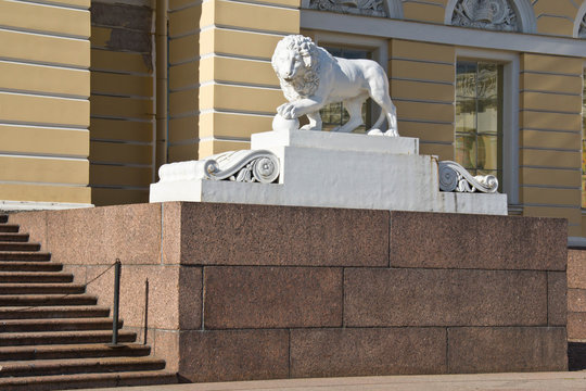 lion monument next to the building