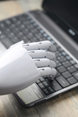 artificial intelligence hand type on keyboard