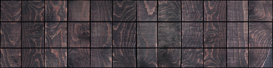 Dark wooden board divided into squares in the panorama - 117374070