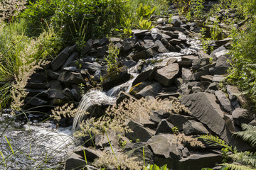 Fototapeta premium Small waterfall between the rocks.