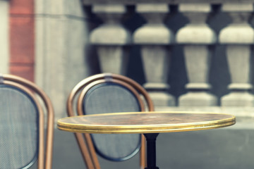 Round table with a chair in a vintage environment