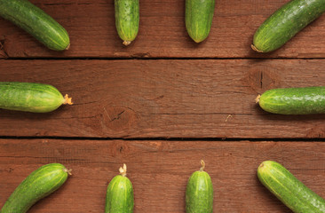 Cucumbers on wooden background