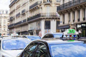 PARIS, FRANCE, on JULY 9, 2016. The Parisian taxi against the background of typical city architecture