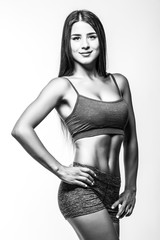 Fototapeta premium attractive fitness woman, trained female body. Black and white photo.
