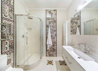 interior of a bathroom with shower and washbasin
