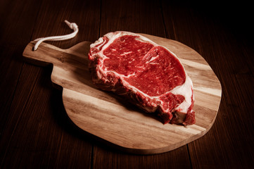Fototapeta premium Entrecote steak of beef on a wooden board
