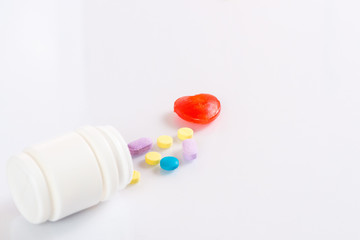The container and medicines isolated on a white background