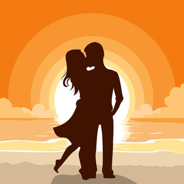 Silhouette of a couple kissing on beach background at sunset