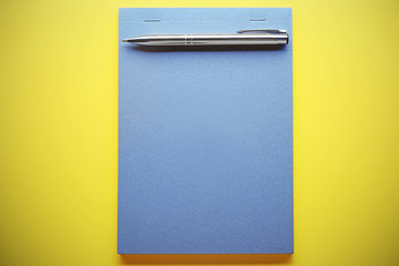 School notebook on color background