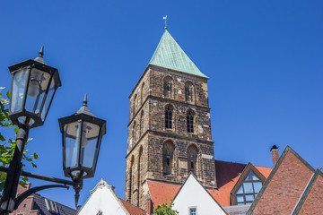 Fototapeta na wymiar Street light and church tower in Rheine