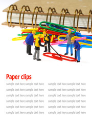 Group of engineer workers are making paper clips isolated on whi