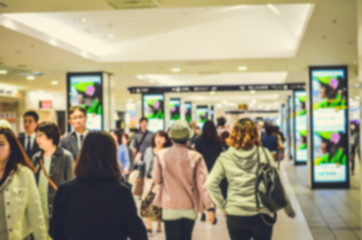 Fototapeta premium Abstract blurred background people walking in shopping center