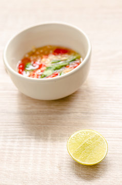 Thai spicy seafood dipping sauce on wooden background