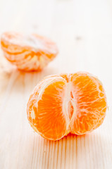 piece of fresh orange on a wooden background