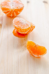 piece of fresh orange on a wooden background