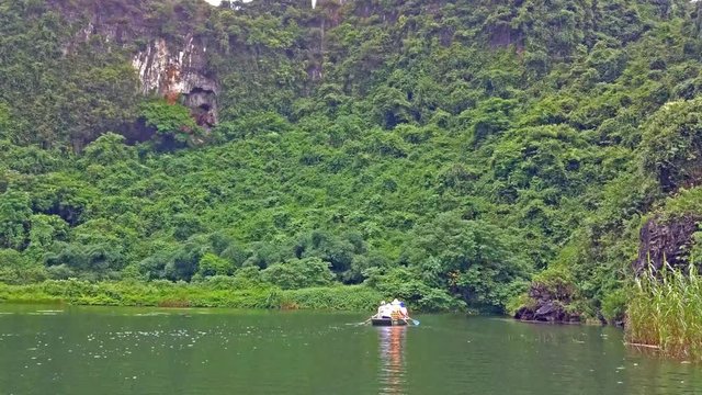 Riding boats in a river in Ninh Binh, Vietnam.