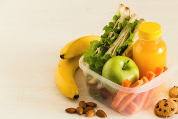 School lunch box with sandwich.