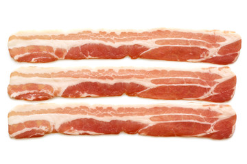 Three strips of streaky uncooked bacon isolated on white from above.