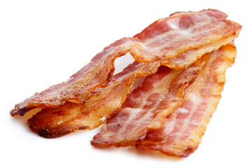 Three strips of fried crispy bacon isolated on white. © Moving Moment