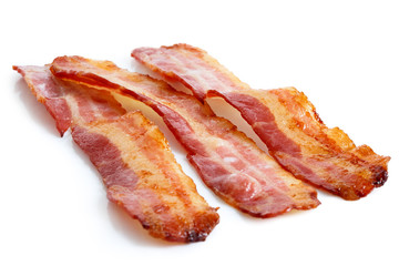 Three strips of fried crispy bacon isolated on white.