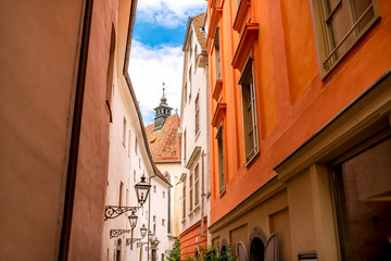 Fototapeta na wymiar Graz old city street view with lanterns and church in Austria