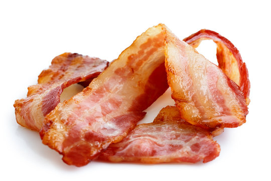 Three strips of fried crispy bacon isolated on white.