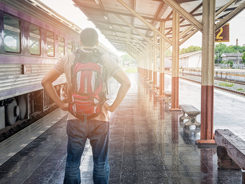 Traveler with backpack in train station. travel concept.