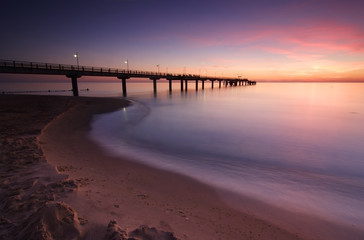 Fototapeta na wymiar Coastal Sunrise, Beach with Long Pier, Usedom Island, Germany