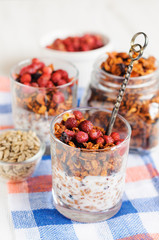 Granola with berries and yogurt in glasses