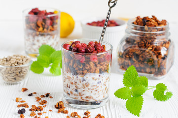 Glass of yogurt with granola and berries