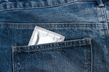 Condoms in package in jeans.