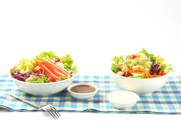 Delicious salad on a bowl isolated over white background.