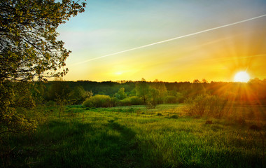 Obraz premium Landscape with the sunrise over the meadow and lines from the ai