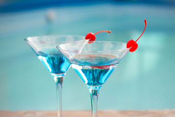 Blue cocktail with a cherry