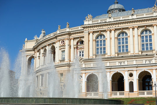 retro style building with fountain, opera theater in odessa city, touristic place