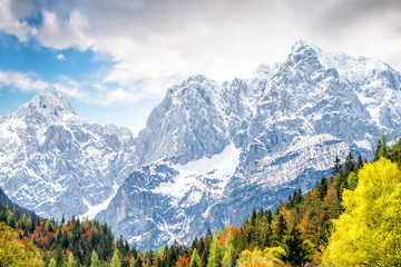 Beautiful landscape view with snowed up mountains in Triglav national park in Slovenia. Traveling slovenian Alps - obrazy, fototapety, plakaty