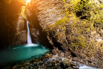 Obraz na płótnie Canvas Kozjak waterfall in Triglav natioanl park in Slovenia. Long exposure technic with motion blurred water