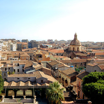 Old buildings and churches of central Catania. Retro photo. City View from the rooftop. Age dphoto. Mediterranean town. Sicily, Italy.